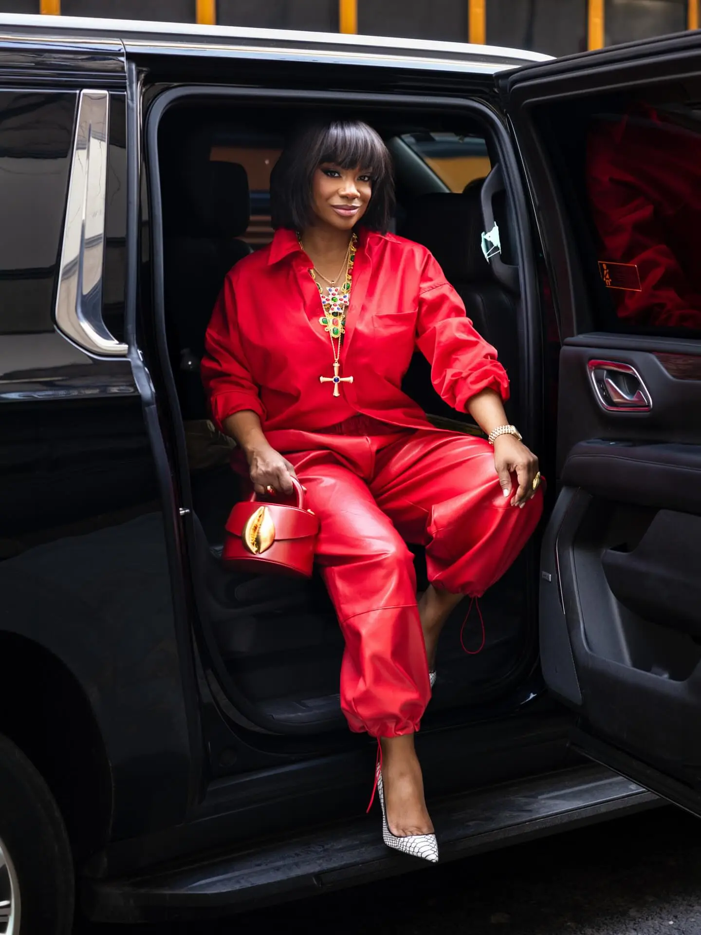 90909 Bomb Accessories Kandi Burruss In Red With A Flore K NY Bag On The Kelly Clarkson Show