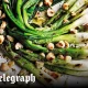 Chargrilled spring onions with hazelnuts and lime and honey dressing