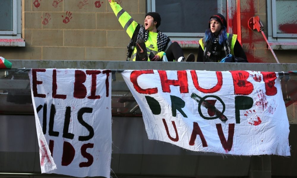 People Against Genocide take action at Chubb's Manchester office