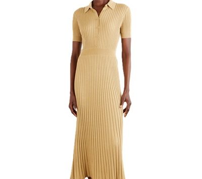 A woman wearing a camel-colored midi dress with short sleeves