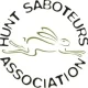A Hunt Saboteur Association logo with an image of a running hare in the middle