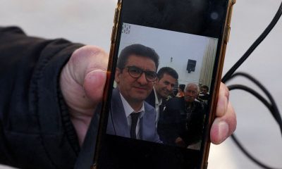 Family of Iranian butcher missing in strike on commercial complex clings to hope