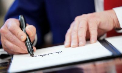 Factbox-Trump’s signature on $100 bill to put him in small circle of sitting presidents