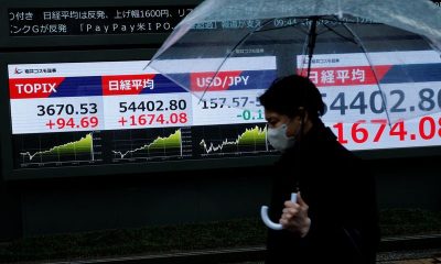 Stocks slide in Asia, Brent crude heads for record monthly rise