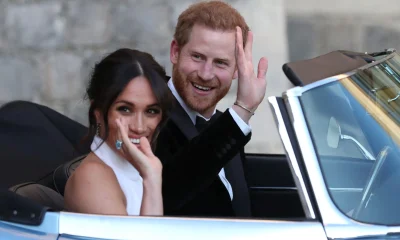 The Duke and Duchess of Sussex drive in an electric Jaguar car