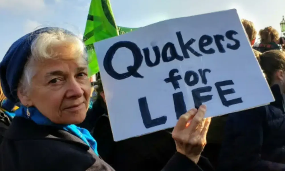 Quakers take silent protest from Scotland Yard to parliament