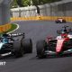 Charles Leclerc and George Russell side by side as they battle for the lead of the lead of the Australian Grand Prix