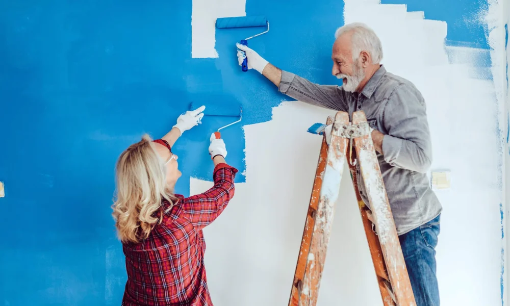 Couple renovating their home using money from equity release lifetime mortgage