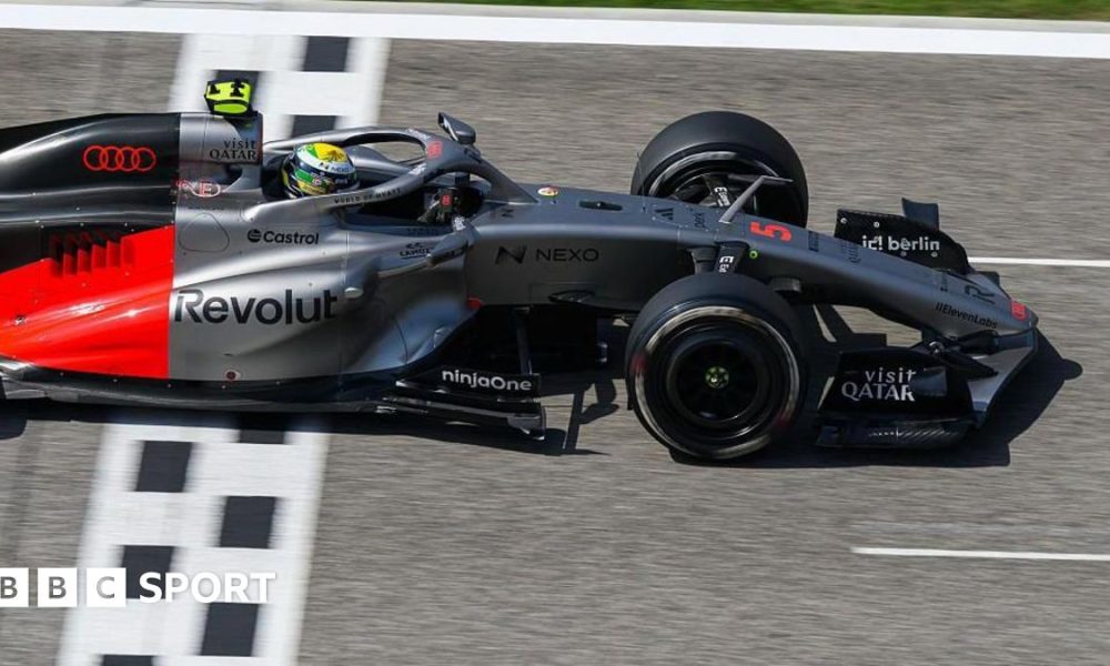 Lewis Hamilton drives the new Ferrari on track in Bahrain, with a McLaren in the background