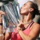 Aryna Sabalenka kisses the Indian Wells trophy