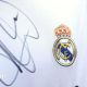 A close up image of a Real Madrid shirt signed by Kylian Mbappe