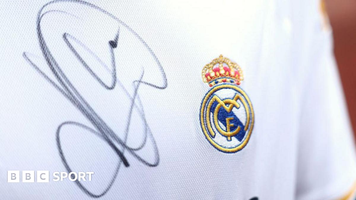 A close up image of a Real Madrid shirt signed by Kylian Mbappe