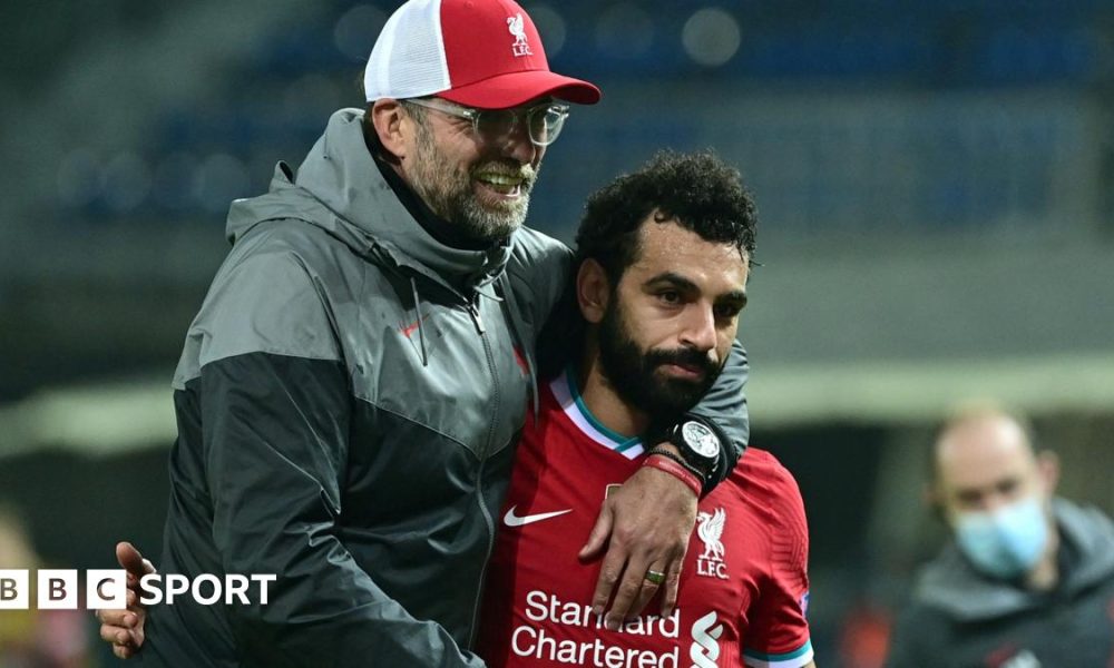 Liverpool boss Jurgen Klopp (left) embraces Mohamed Salah (right) after a Chamoions League match
