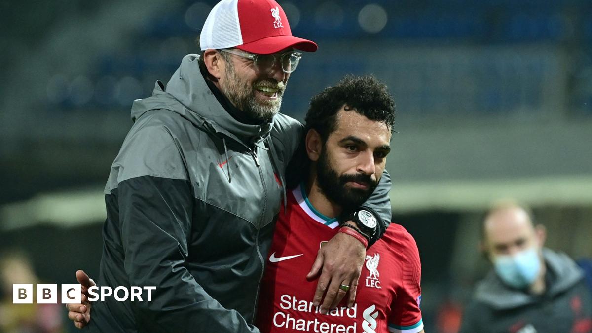 Liverpool boss Jurgen Klopp (left) embraces Mohamed Salah (right) after a Chamoions League match