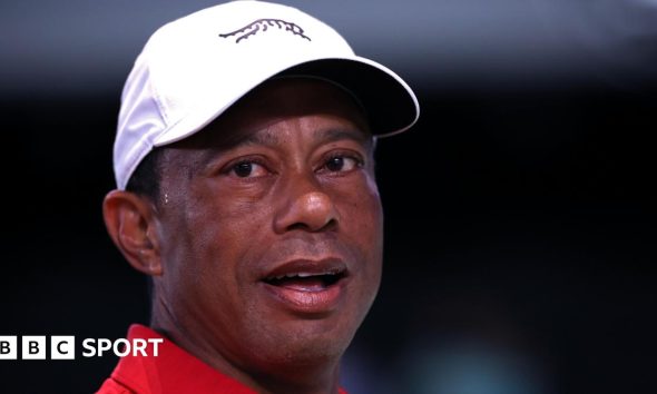 Tiger Woods looks on