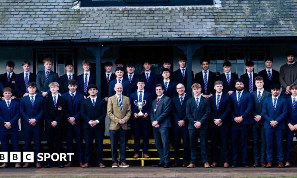 Students and coaches from Northampton School for Boys have their picture taken with the Daily Mail Trophy