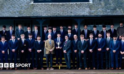 Students and coaches from Northampton School for Boys have their picture taken with the Daily Mail Trophy