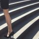 stylish businesswoman climbing stairs