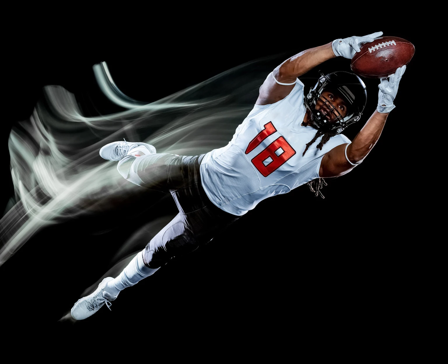 american football player man isolated black background light painting