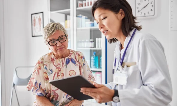 Doctor sharing medical results with woman