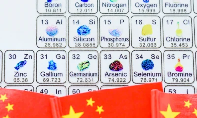 China’s export controls on gallium, germanium, and rare earths, US-China trade tensions over strategic resources, global semiconductor and EV supply chain risks: The periodic table with Chinese flags.