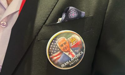 Scores of mostly older conservatives milled about wearing shirts, pins, and other items with the image of exiled Iran Crown Prince Reza Pahlavi, who is set to speak at the conference on Saturday.
