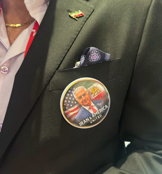 Scores of mostly older conservatives milled about wearing shirts, pins, and other items with the image of exiled Iran Crown Prince Reza Pahlavi, who is set to speak at the conference on Saturday.
