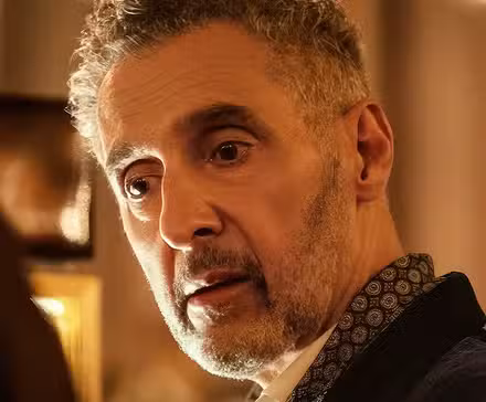 John Turturro looking skeptical in Mr. & Mrs. Smith