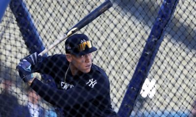 New York Yankees captain Aaron Judge warms up at Dodger Stadium ahead of Friday's opener