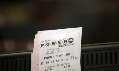 Powerball tickets rest on a 7-Eleven store register January 9, 2016 in Chicago, Illinois.