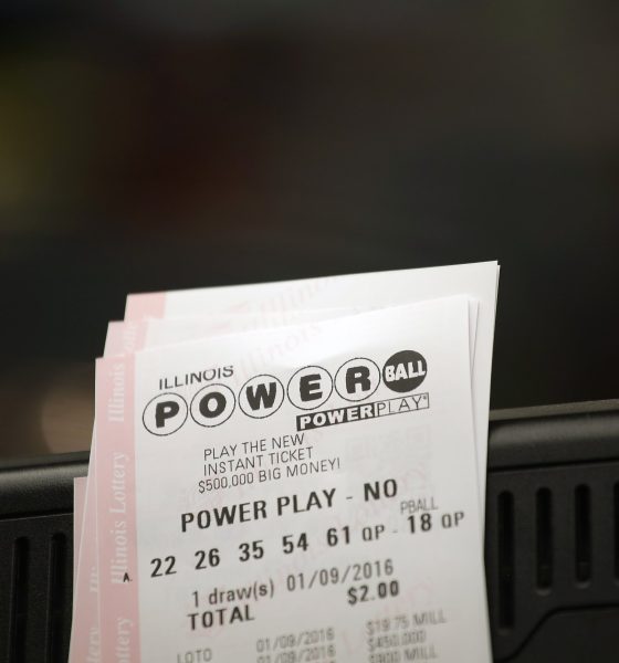 Powerball tickets rest on a 7-Eleven store register January 9, 2016 in Chicago, Illinois.