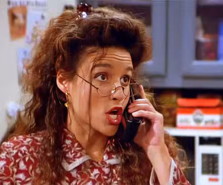 Elaine (Julia Louis-Dreyfus) talking on the phone in the 'Seinfeld' episode