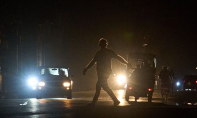 A man crosses a street in Havana, Cuba, after a power outage at a thermoelectric plant. Pic: AP