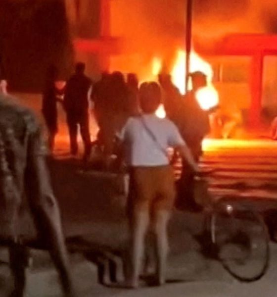 Social media footage of a riot in Cuba showed protesters throwing rocks through windows. Pic: Reuters