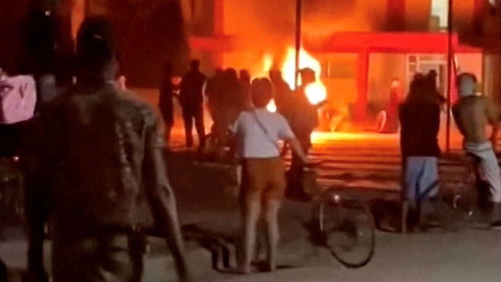 Social media footage of a riot in Cuba showed protesters throwing rocks through windows. Pic: Reuters