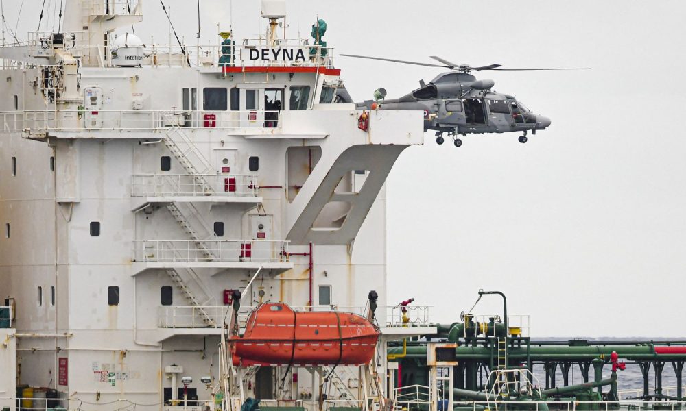 A French Navy helicopter hovers over the Deyna before it is boarded. Pic: Reuters
