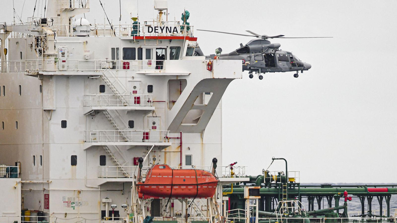 A French Navy helicopter hovers over the Deyna before it is boarded. Pic: Reuters
