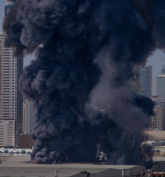 Smoke rises after a strike on a warehouse in Sharjah City in Dubai. Pic: AP