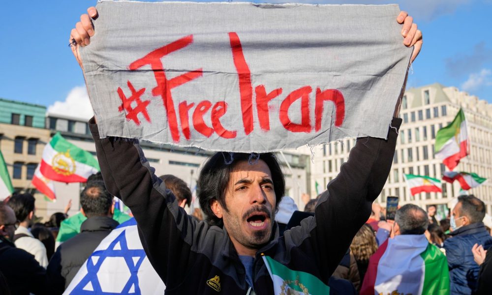 Iranian people in Berlin at a demonstration in support of the US and Israeli strikes on Iran. Pic: AP