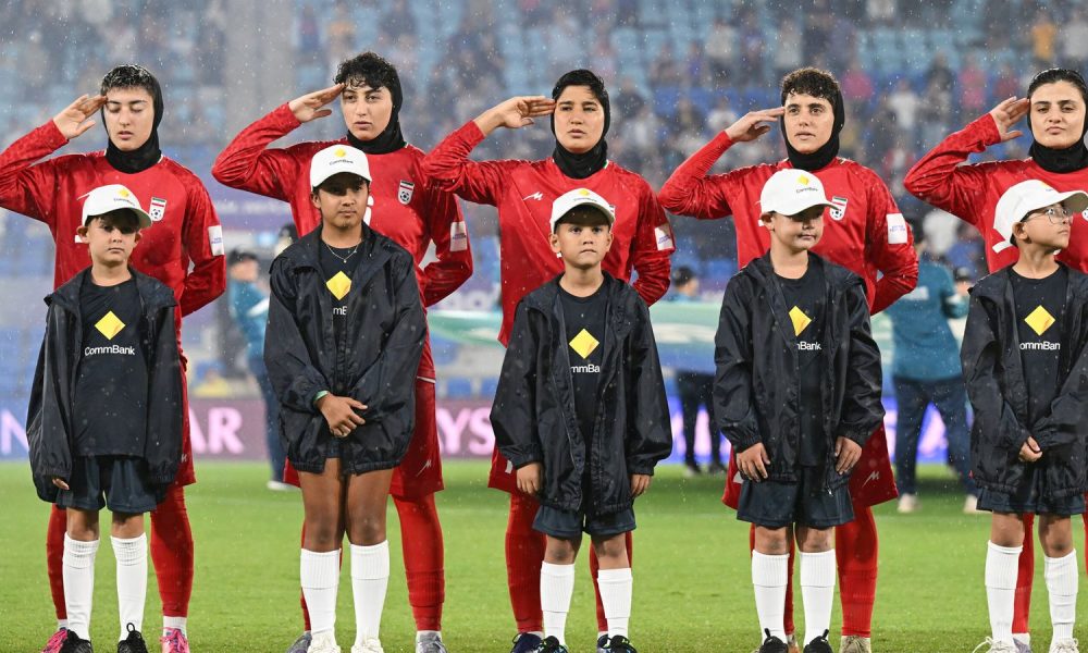 The Iranian team during their national anthem before the match with the Philippines on Sunday. Pic: Dave Hunt/AAP Image via AP