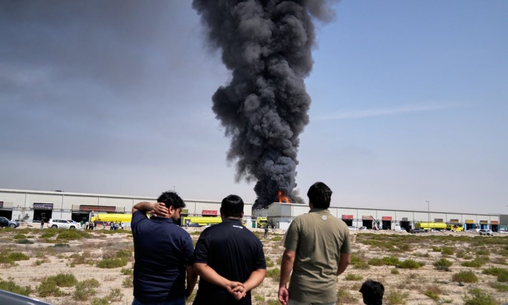 Smoke rises from a warehouse in Sharjah City, UAE, but most of the drones and missiles have been shot down. Pic: AP