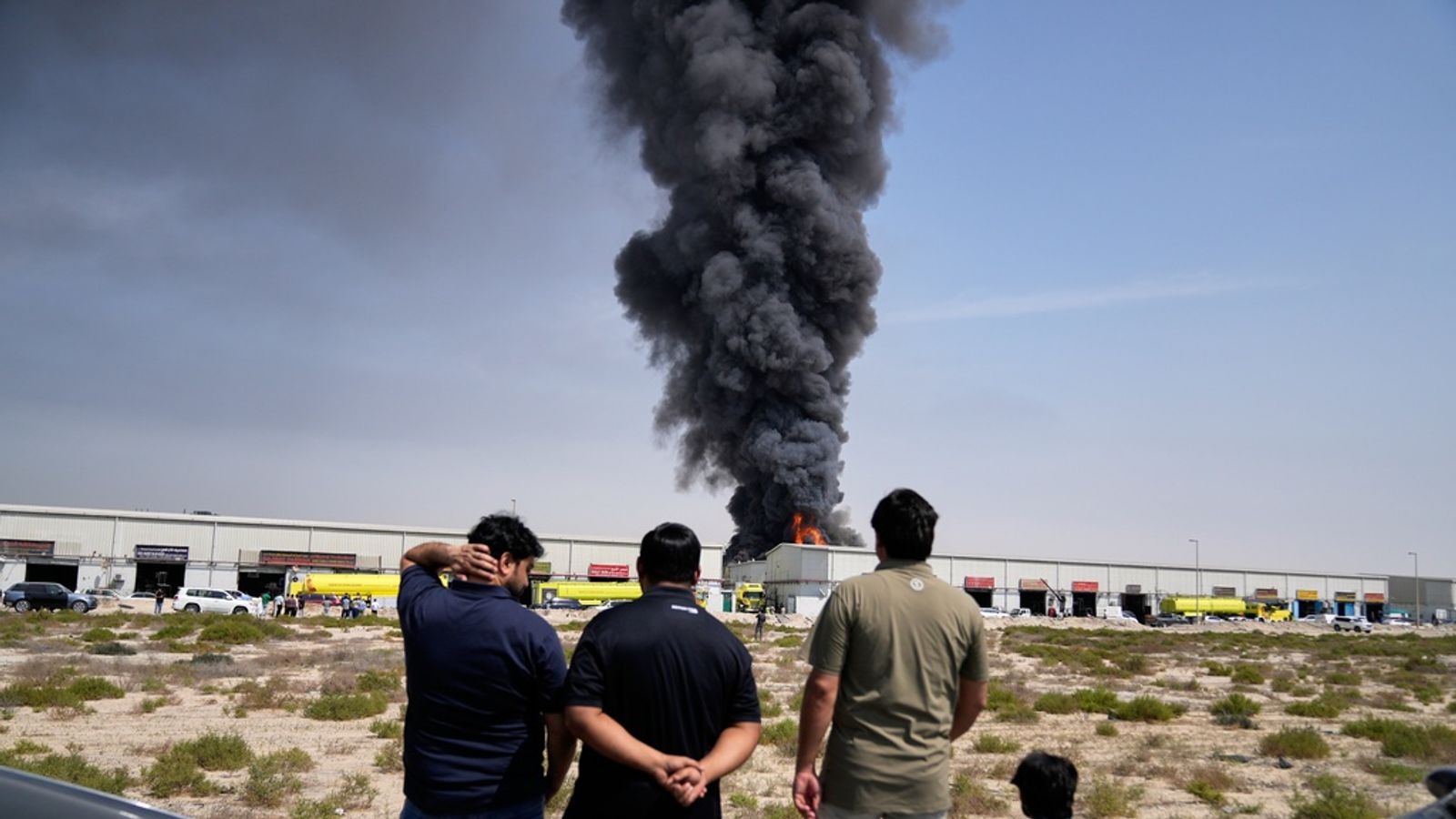Smoke rises from a warehouse in Sharjah City, UAE, but most of the drones and missiles have been shot down. Pic: AP