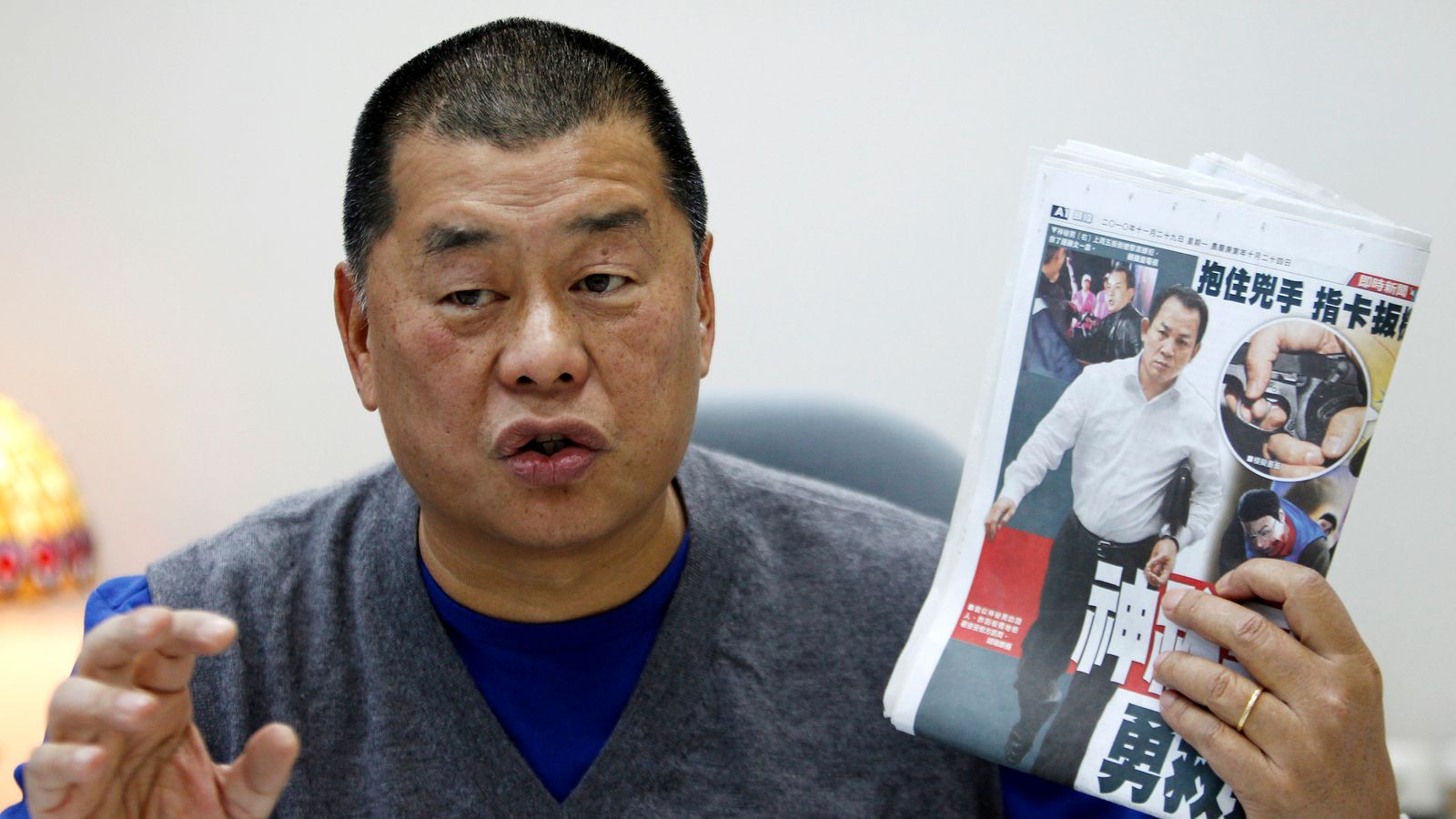 Jimmy Lai with a copy of his newspaper Apple Daily in 2010. File pic: Reuters
