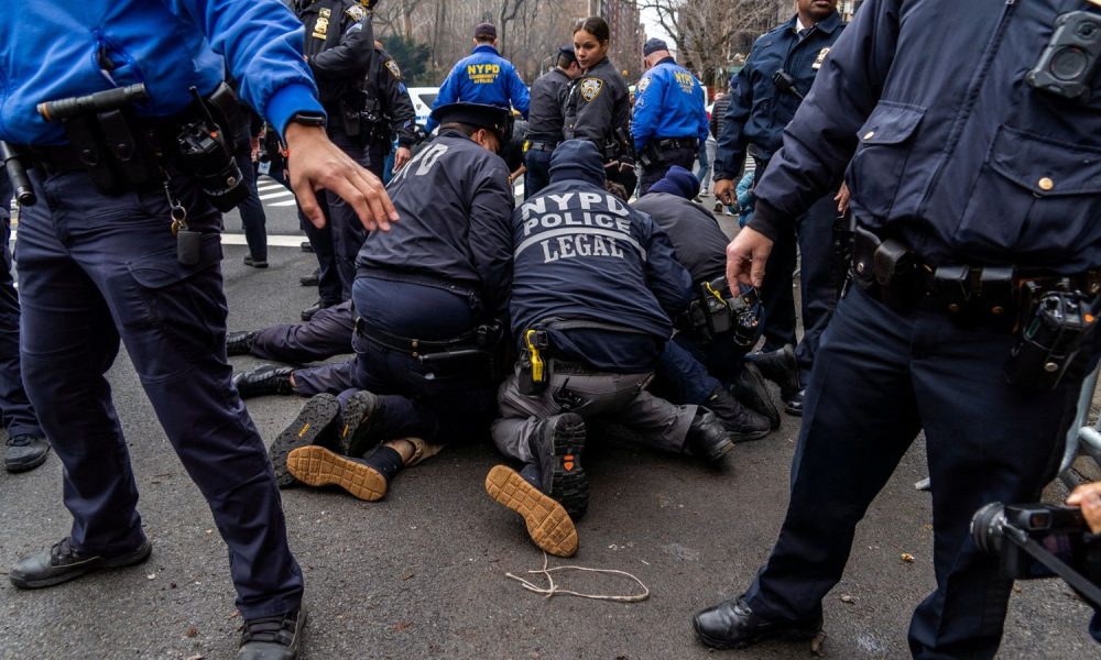 Counter-protester arrested by the NYPD. Pic: Reuters