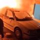 A man tries to put out a car fire in Deir al-Hatab, in the West Bank. Pic: AP