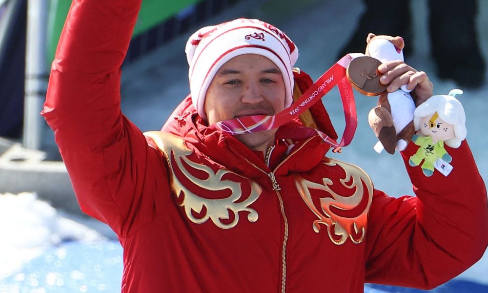 Bronze medalist Aleksei Bugaev of Russia celebrates on the podium. Pic: Reuters