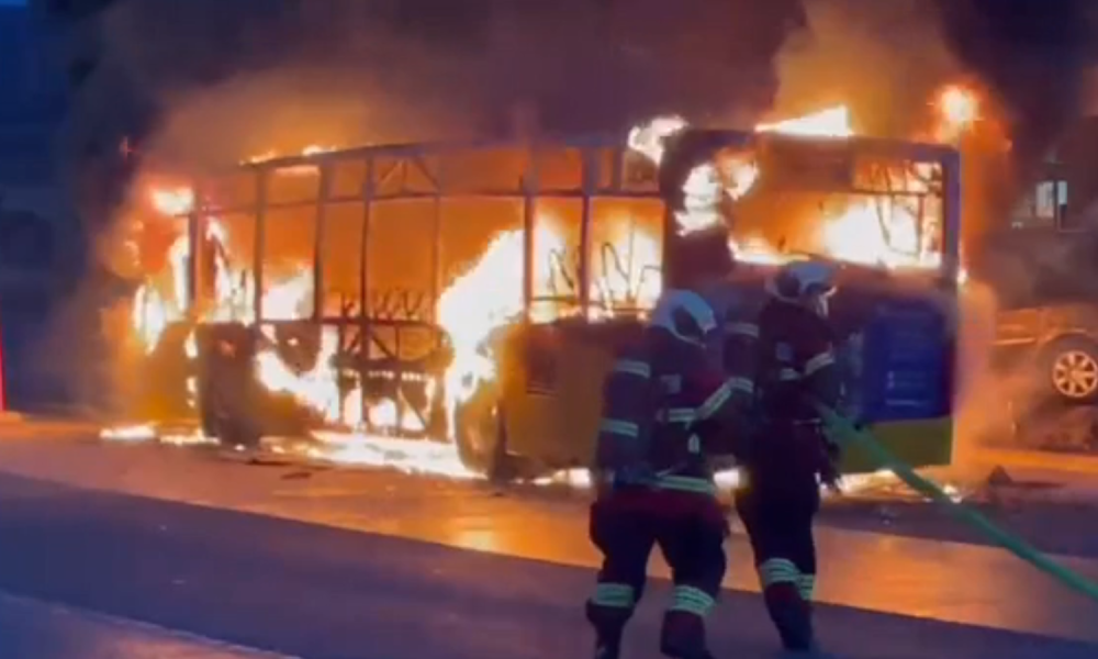 Firefighters approach the bus. Pic: Wir Freiburg
