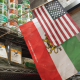 Iran's pre-Islamic Revolution flag alongside the US flag at Mr Saddigh's shop