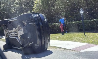 Tiger Woods standing near his overturned vehicle in Jupiter Island, Florida. Pic: AP