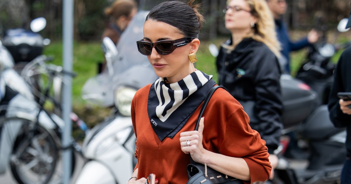 MILAN, ITALY - FEBRUARY 27: Alexandra Pereira wears black leather skirt, scarf, v neck, bag outside Tods during the Milan Fashion Week - Womenswear Fall/Winter 2026/2027 on February 27, 2026 in Milan, Italy. (Photo by Christian Vierig/Getty Images)